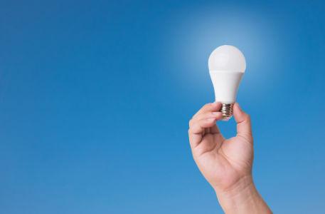 LED lightbulb, hand holding bulb, illumination, 