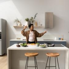woman behind counter, kitchen island, renovation, homebuying, kitchen