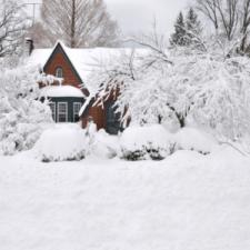 winterize home, snow covered home, shoveling, freezing pipes